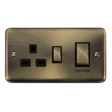 Curved Antique Brass 45A Ingot 2 Gang DP Switch With 13A DP Switched Plug Socket - Black Trim - SE Home