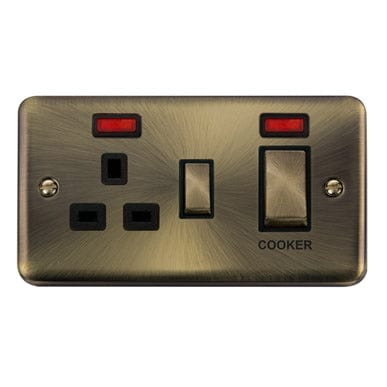 Curved Antique Brass 45A Ingot 2 Gang DP Switch With 13A DP Switched Plug Socket & Neons - Black Trim - SE Home