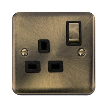 Curved Antique Brass 13A Ingot 1 Gang DP Switched Plug Socket - Black Trim - SE Home