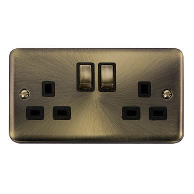Curved Antique Brass 13A Ingot 2 Gang DP Switched Plug Socket - Black Trim - SE Home